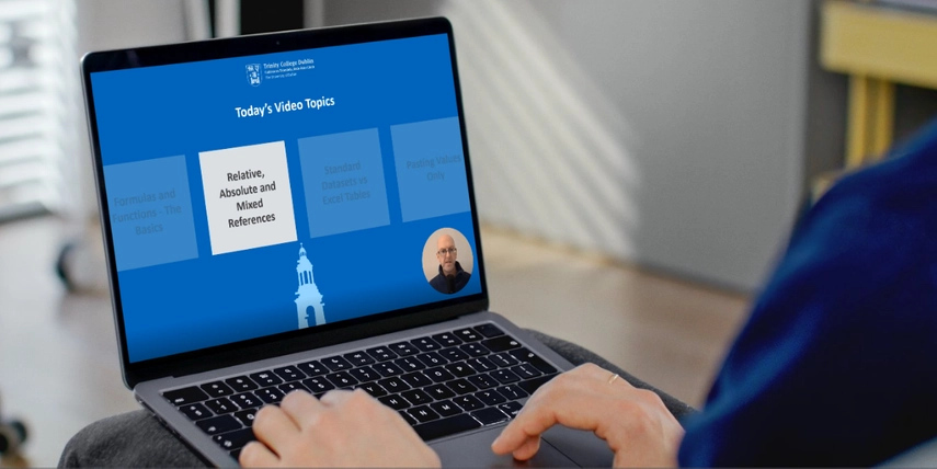 Image of hands and laptop with a screen from the Excel training open