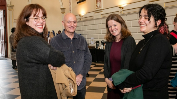 Two students and two academics at the 2025 Trinity Research Doctorate Awards ceremony.