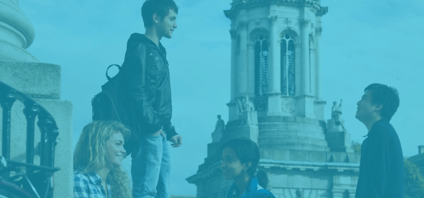 Students in conversation with Trinity's Campanile in the background.