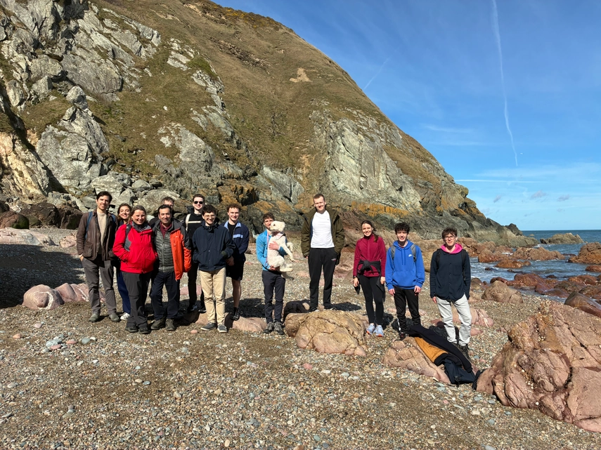 Annual Howth Cliff Walk students and academics together under the sun. In the background the cliff