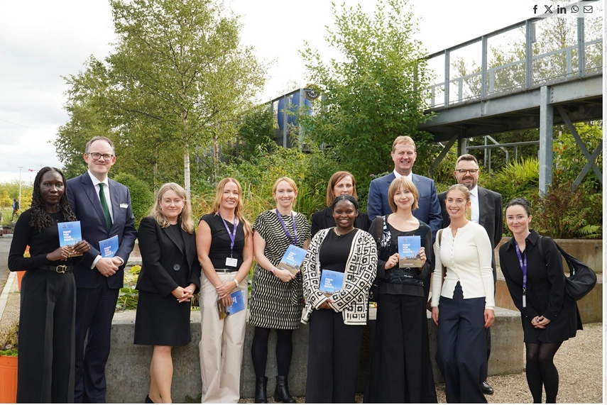 LLM students and Ballymun Community Law Centre staff stand outdoors holding 