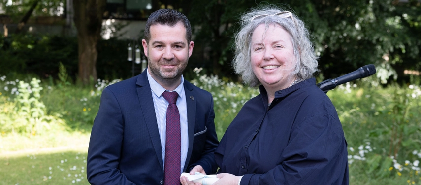 Dr Martin McMahon receives an award from the Provost