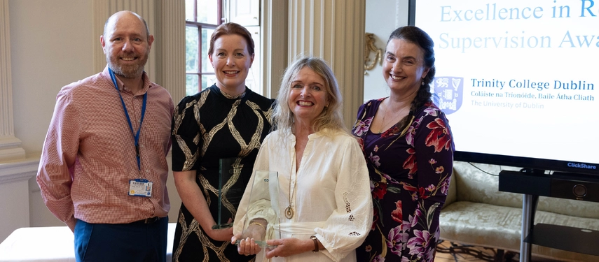 Colleagues support Prof Catherine Comiskey and Dr Mary Hughes as they receive awards for excellence