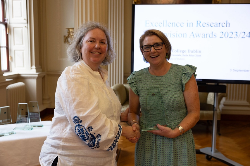 Siobhán Corrigan receiving an award from TCD Provost