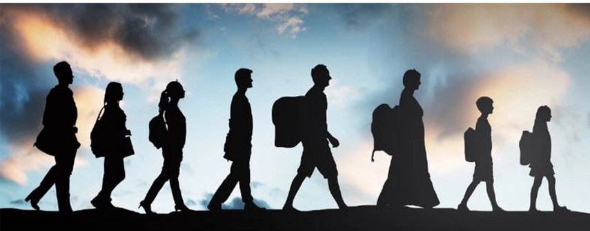 group of people walking in siloutette