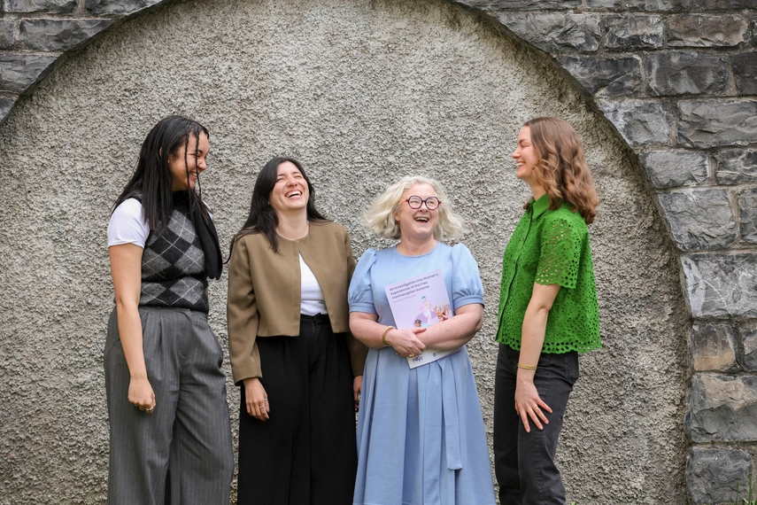 4 people laughing together