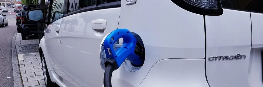 An electric vehicle being charged