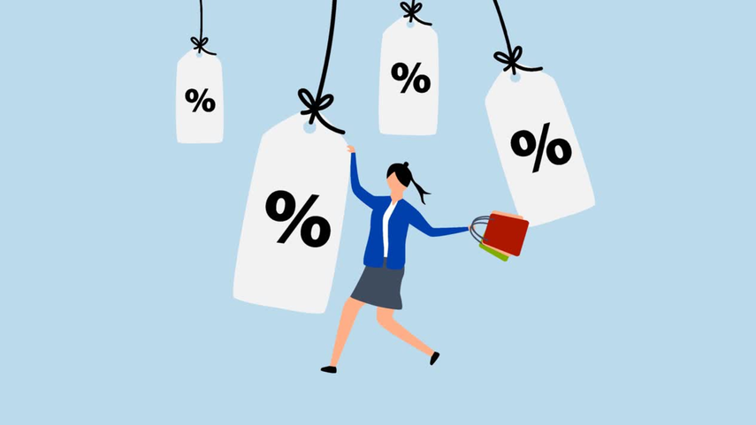 A person holding shopping bags and tags