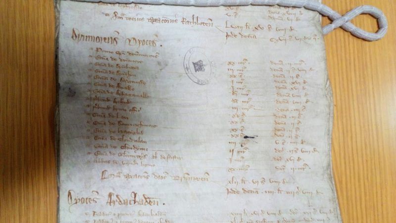 An example of the medieval long rolls that the work is based on. The rolls are currently housed within the National Archives in Kew.