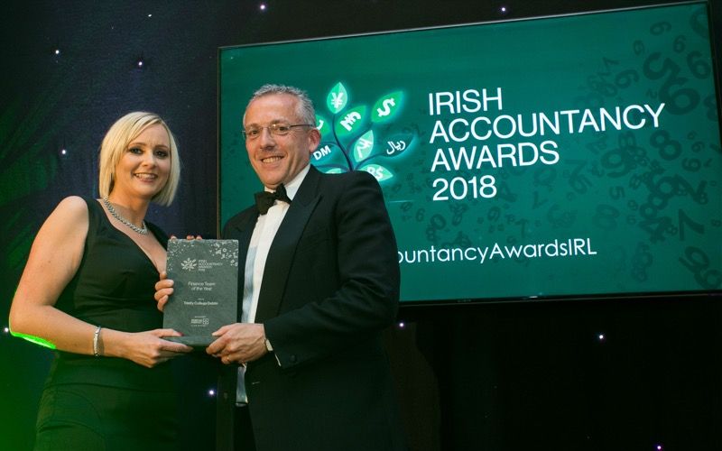 Ian Mathews, Chief Financial Officer is congratulated by Aileen McCarney, Associate Director, Morgan McKinley, award sponsor 