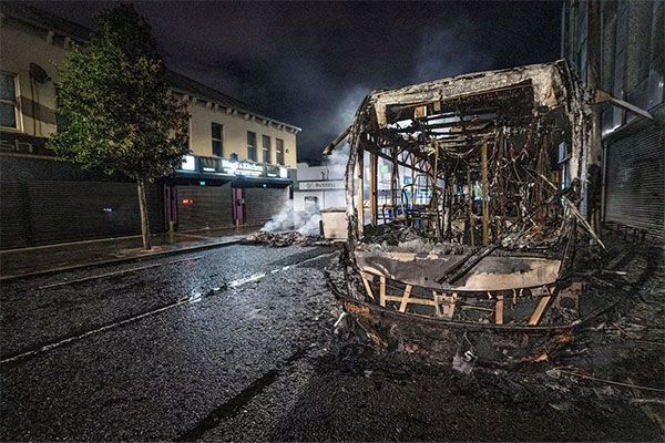 Image of burnt out bus in Belfast.