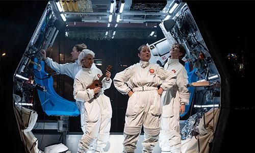 Image of astronauts in a spacecraft.