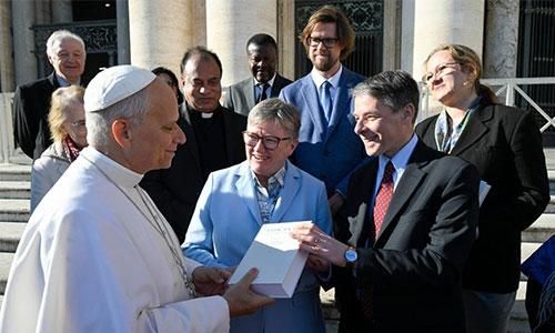 Professor Massimo Faggioli, School of Religion, Theology, and Peace Studies, presents volume of research on Vatican II to Pope Leo XIV