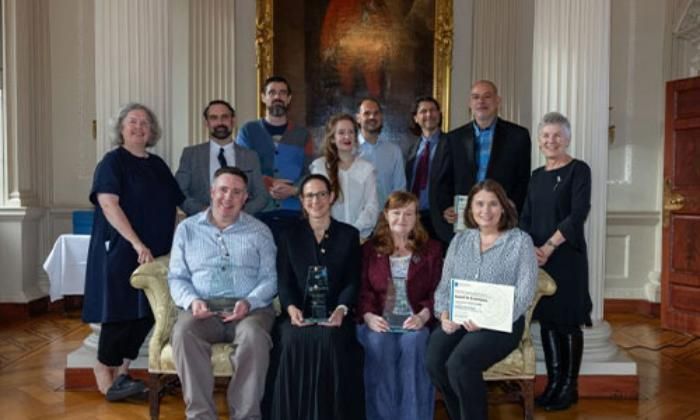 Image of Provost and some staff awarded and nominated for excellence in research supervision.