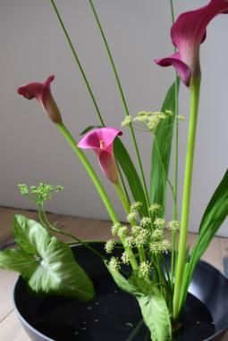 Low bowl with purple lilies and other summer flowers