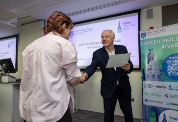 Student receiving Trinity Career Skills Award cert