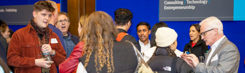 Trinity alumni talking to current students at a career event