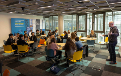 Medical and nursing students working on test patient dummies in a hospital ward