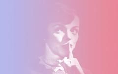 A woman whispering with her finger over her mouth