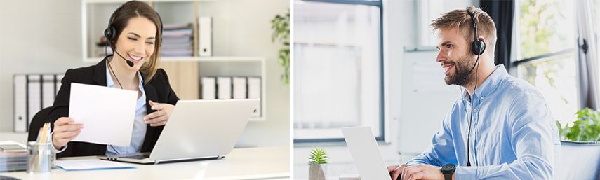 Female and male executives working on laptops with headsets