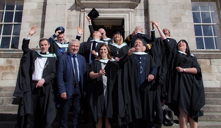 Graduation students of CIHS Course throwing caps in air