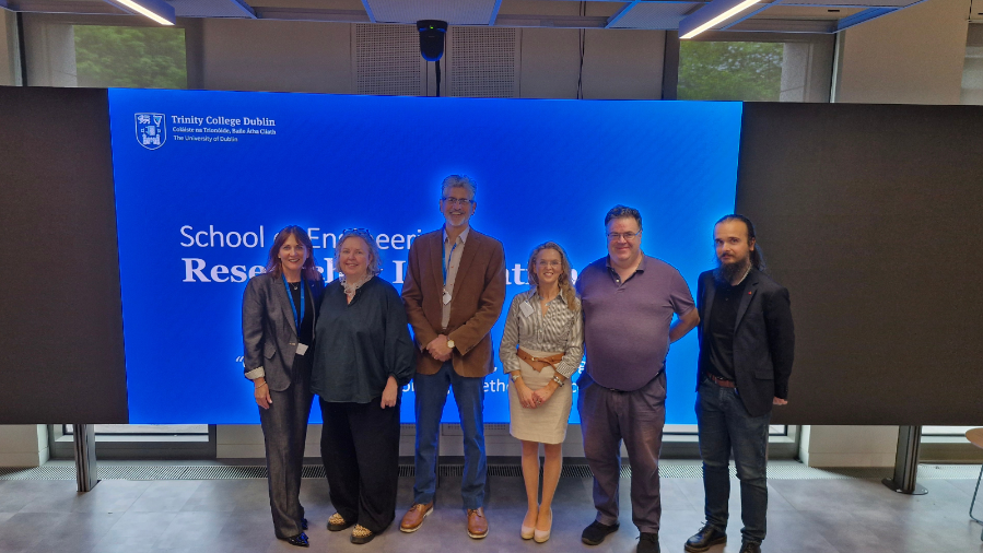 an image of the Research & Innovation Showcase 2026 Session Leads in front of a large presentation screen
