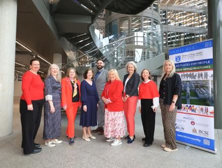A group of people standing in a foyer