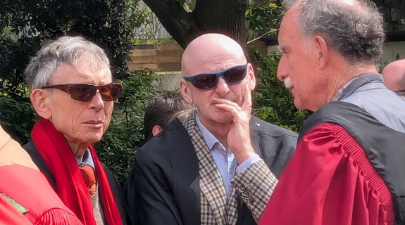 Three men in academic robes.
