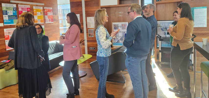 School colleagues in conversation in Trinity Long Room Hub.