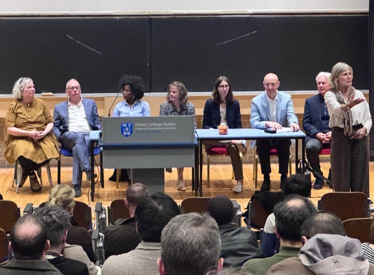 A p[anel of people address an event