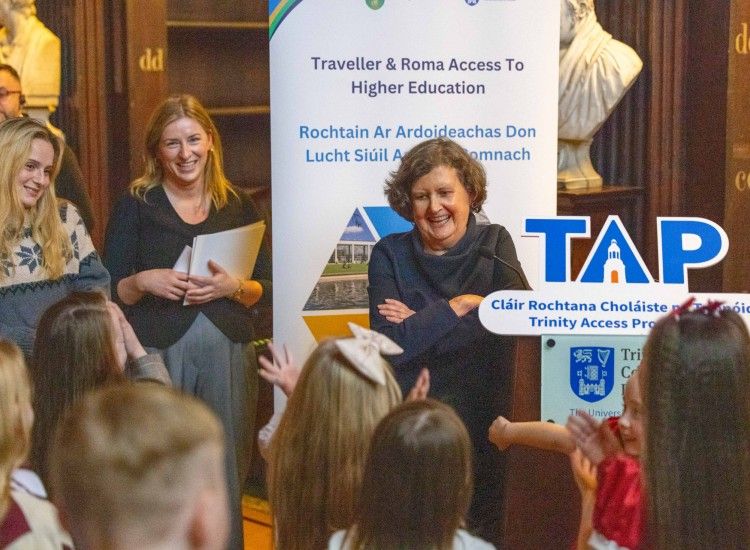 Woman laughs as she makes presentation