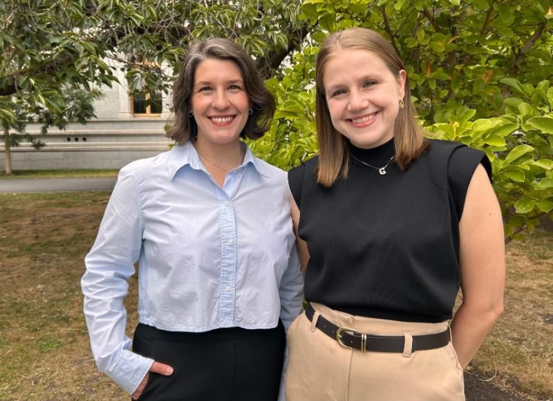 Dr Casey Platnich with Dr Gabriela Kronemberger in Trinity's Rose Garden