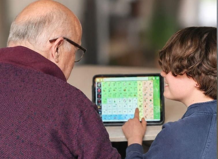 Child and grandfather looking at Geabaire
