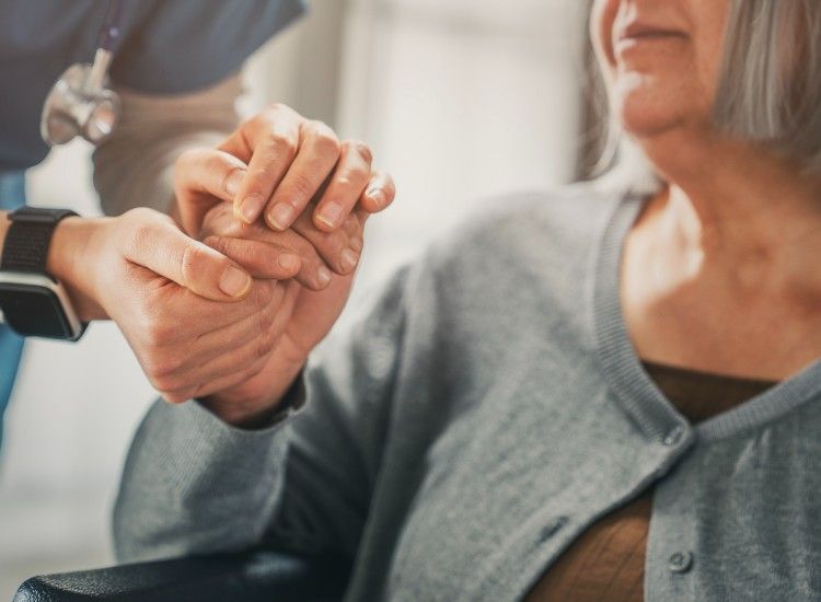 Image of a carer and a elderly person