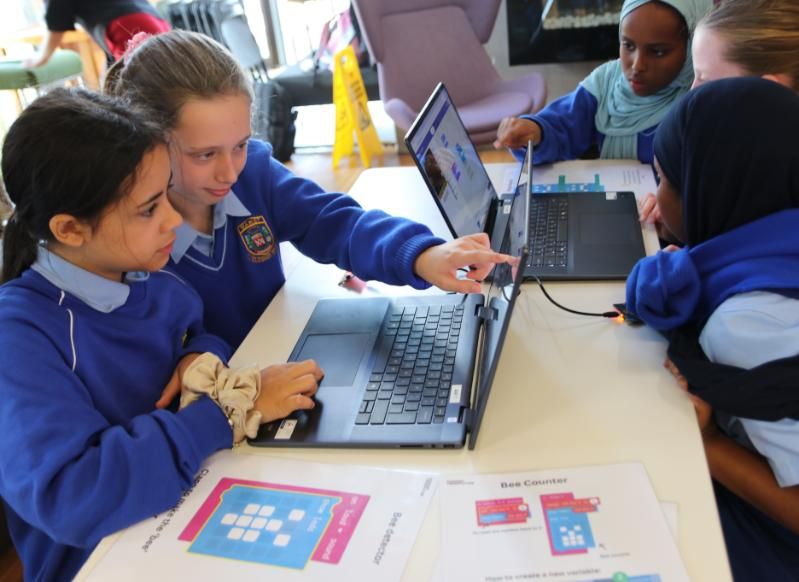 Schoolchildren work on their solutions as part of The Connective Detective