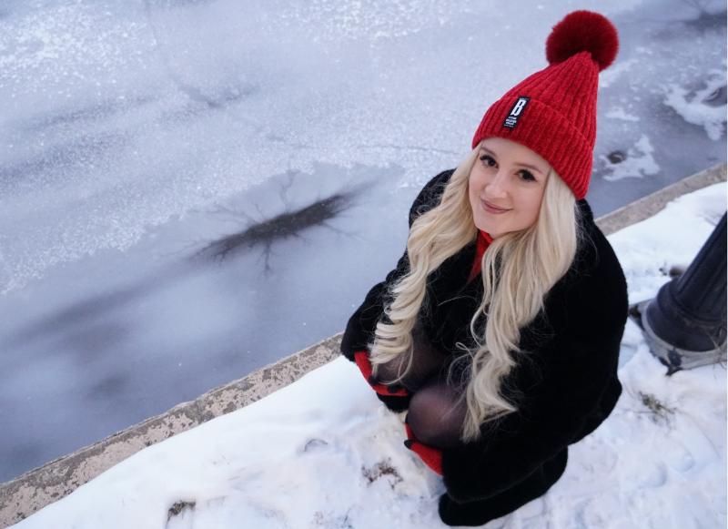 Dr Lauren Mc Keown with a lake star in frozen water behind.