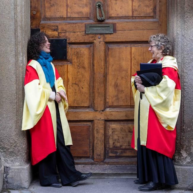 Mary Pyle and supervisor Joanne Carroll in graduation robes