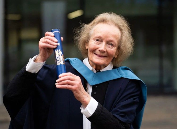 Elderly woman graduates