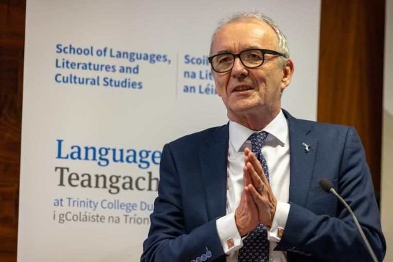 Man in a suit speaking