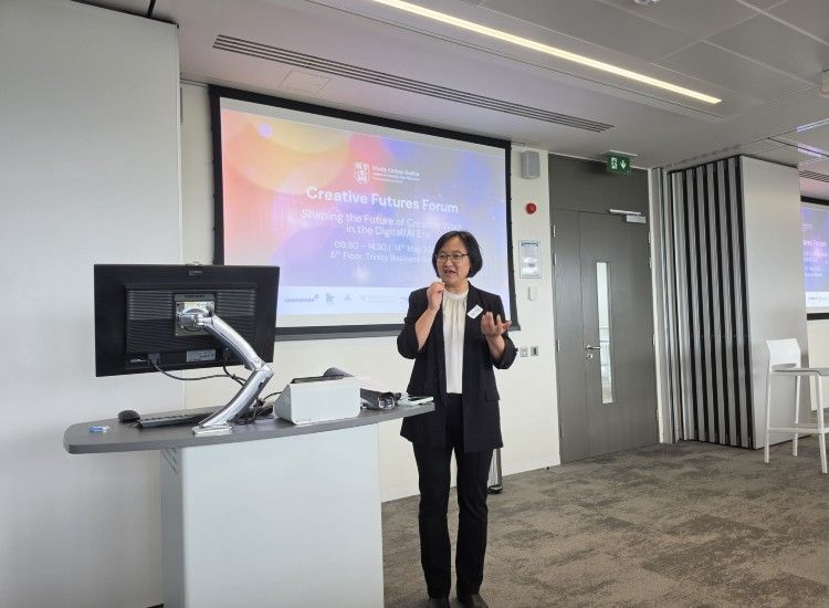 Woman presents in front of board