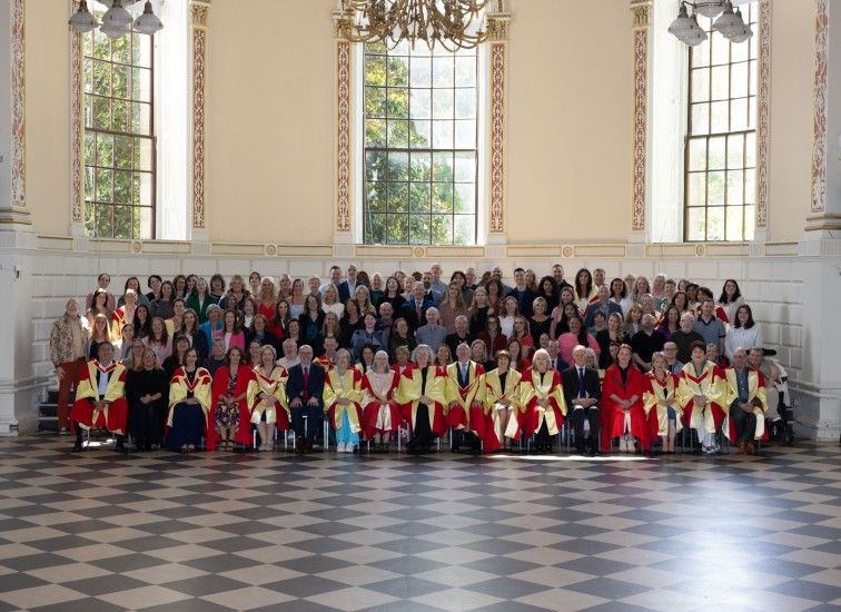Large group pose in formal setting