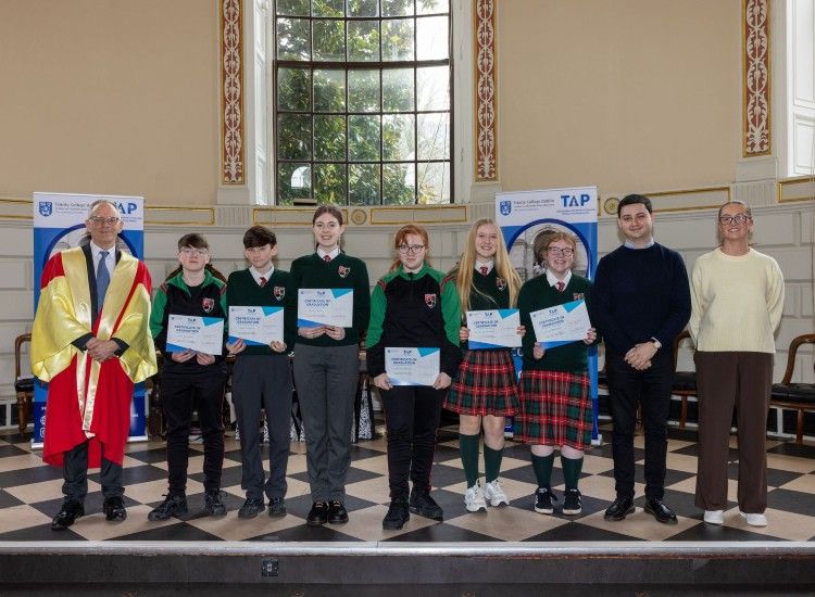 Young people assembled with certificates