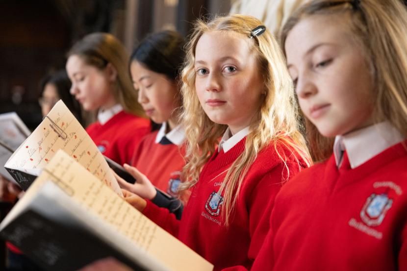 Group of five girls holding books in Trinity's Long Room