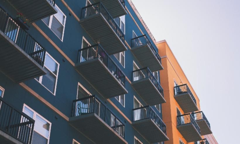 image of apartment block orange and black