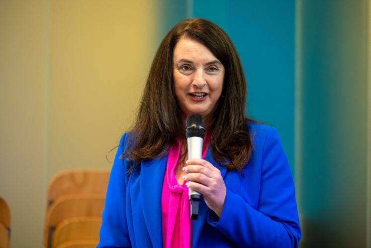 Melissa Corbally speaks with microphone