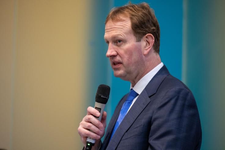 Jim O'Callaghan using microphone