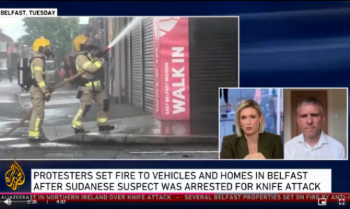 Screenshot of David Mitchell being interviewed on Al Jazeera news programme