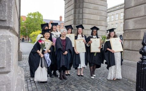 Students and Head of School celebrate under the Campanile at graduation 2026
