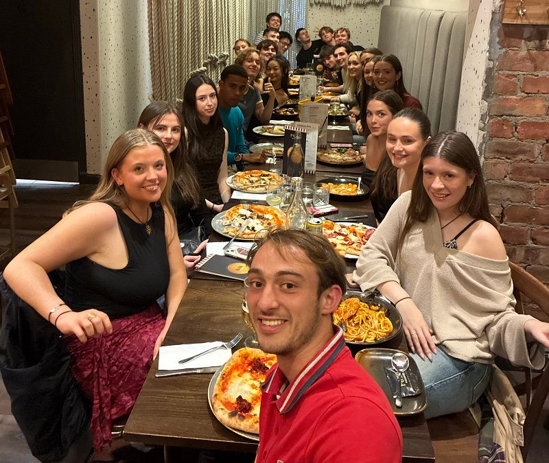 Trinity basketball at Edinburgh Invitational September 2025 informal group photo at dinner