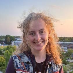 Student with blonde hair smiling